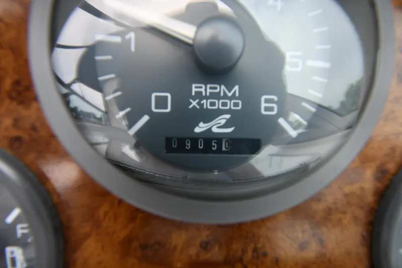 Slide: The Image of Close-up of 1995 Sea Ray 330 Sundancer RPM gauge showing 9050. - 14
