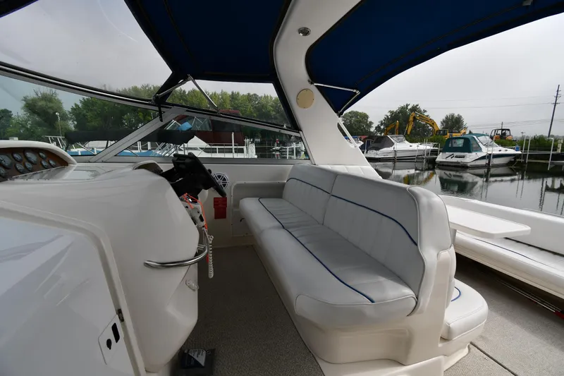 Slide: The Image of Interior of a 1995 Sea Ray 330 Sundancer boat with seating and helm. - 15