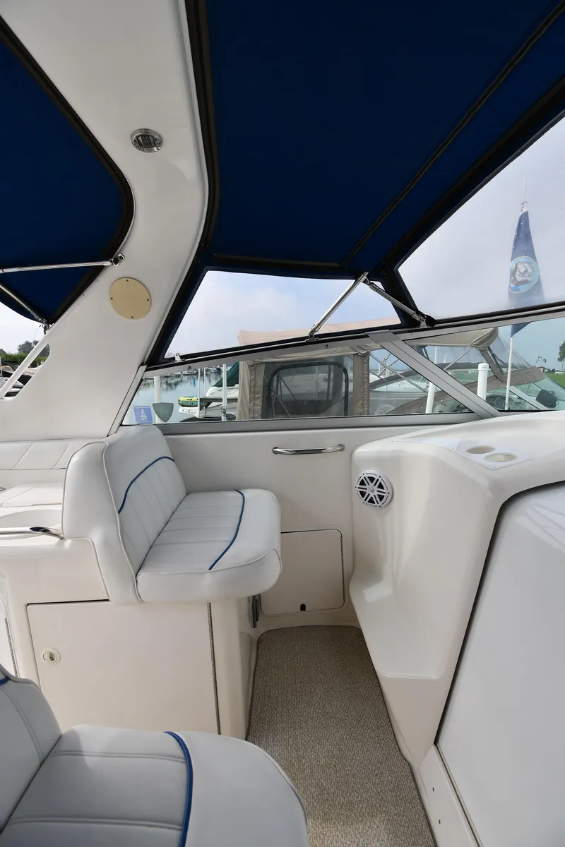 Slide: The Image of Interior view of 1995 Sea Ray 330 Sundancer boat with blue accents and seating. - 18
