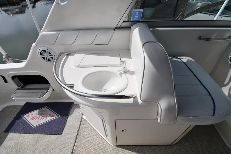 Slide: The Image of 1995 Sea Ray 330 Sundancer interior with sink and seating area. - 25