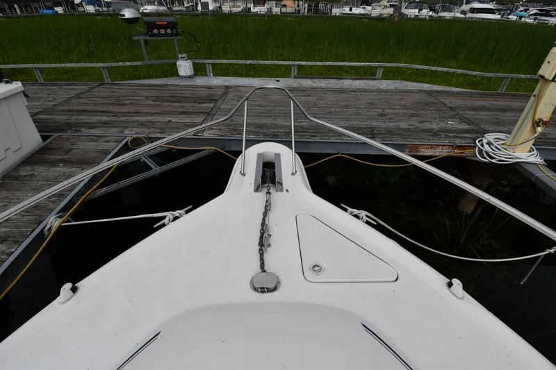 Slide: The Image of Bow of 1995 Sea Ray 330 Sundancer docked at marina. - 3