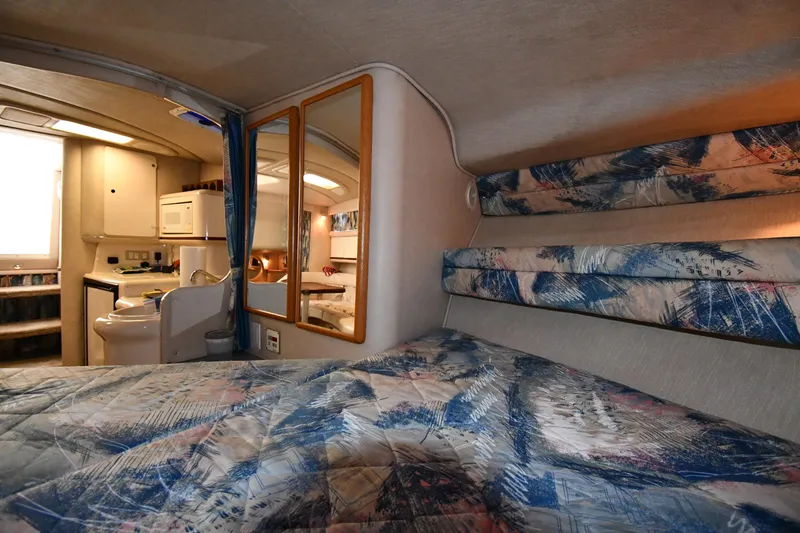 Slide: The Image of Interior of 1995 Sea Ray 330 Sundancer with cozy cabin and kitchenette. - 34