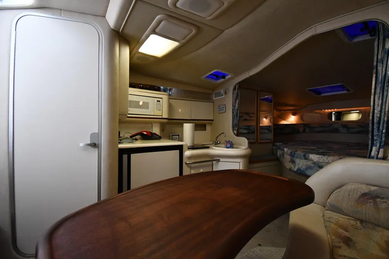 Slide: The Image of Interior of 1995 Sea Ray 330 Sundancer with kitchenette and sleeping area. - 38