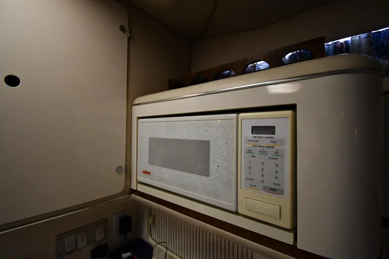 Slide: The Image of Microwave in 1995 Sea Ray 330 Sundancer yacht kitchen interior. - 46
