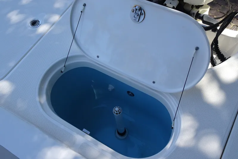 Slide: The Image of Open livewell on 2015 Pioneer 186 Cape Island boat, showcasing interior design. - 15