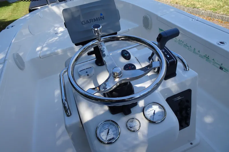 Slide: The Image of 2015 Pioneer 186 Cape Island boat dashboard with Garmin GPS and chrome steering wheel. - 17