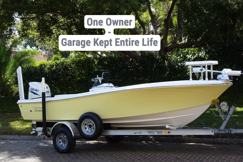 Slide: The Image of 2015 Pioneer 186 Cape Island boat, yellow hull, on trailer, garage kept, one owner. - 2