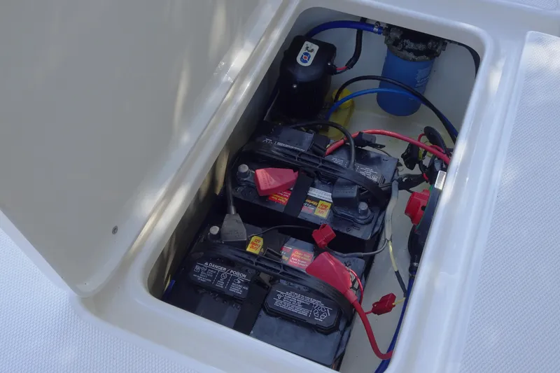 Slide: The Image of 2015 Pioneer 186 Cape Island boat battery compartment with wiring and components. - 20