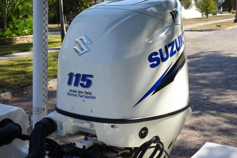 Slide: The Image of Suzuki 115 outboard motor on 2015 Pioneer 186 Cape Island boat, featuring electronic fuel injection. - 21