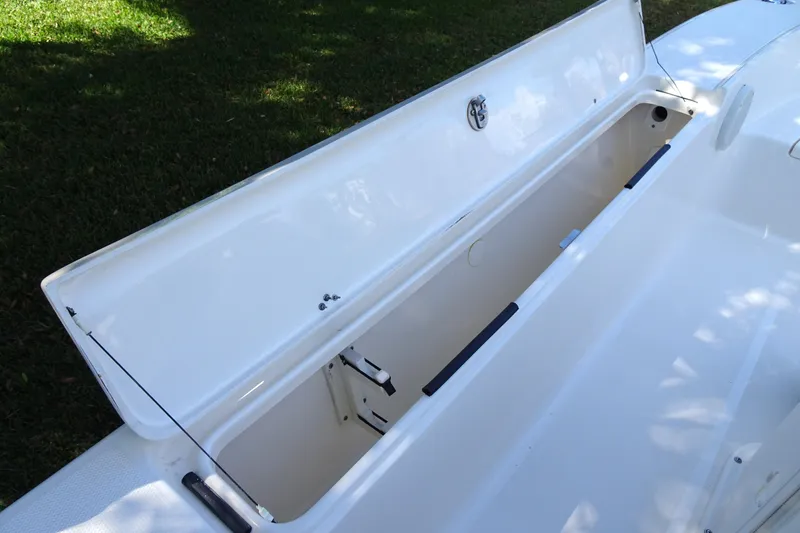 Slide: The Image of Open storage compartment on 2015 Pioneer 186 Cape Island boat, showcasing interior space. - 26