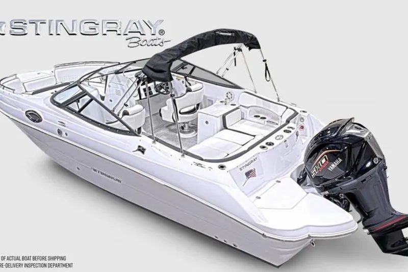 Slide: The Image of 2026 Stingray 231 DC boat with Yamaha engine, sleek design, and spacious seating. - 3