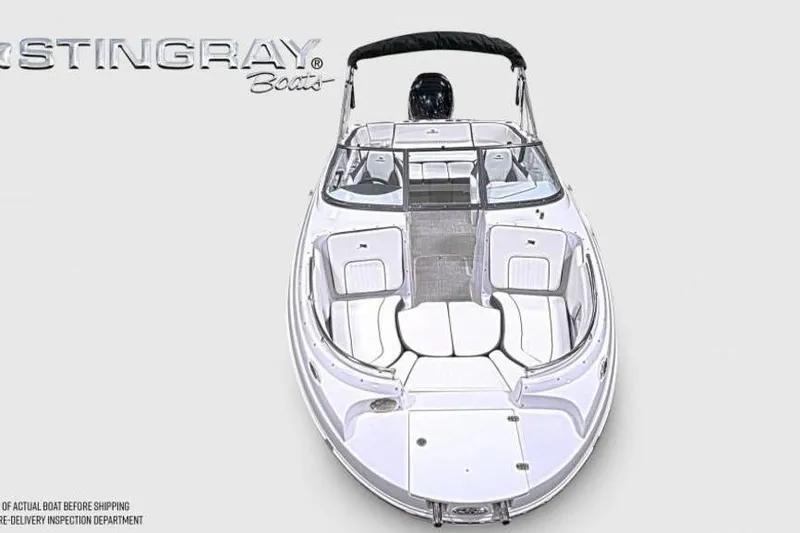 Slide: The Image of 2026 Stingray 231 DC boat, top view, showcasing sleek design and spacious seating. - 4