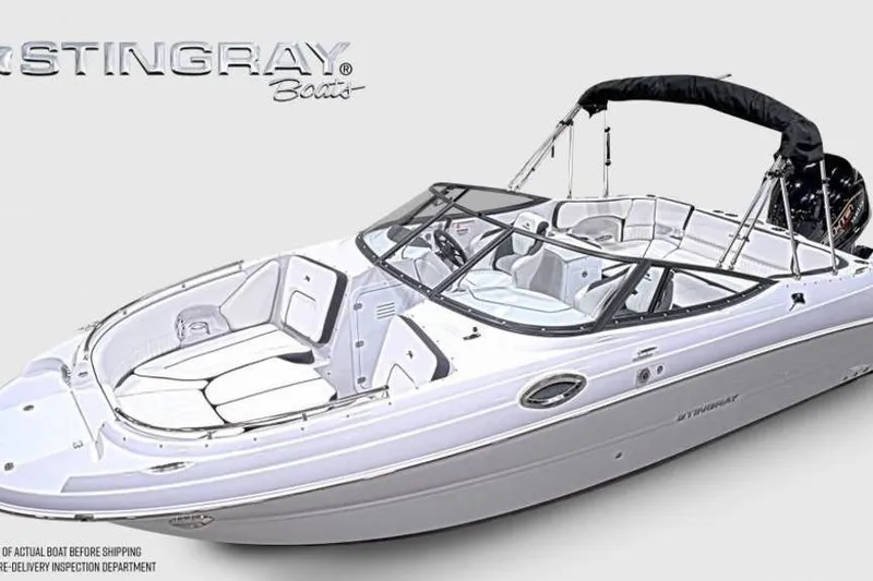 Slide: The Image of 2026 Stingray 231 DC boat with sleek design and spacious seating. - 5