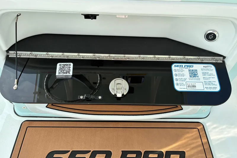 Slide: The Image of 2026 Sea Pro 245FLX Sandbar boat dashboard with QR codes and control panel. - 11