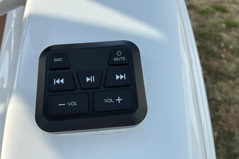 Slide: The Image of Audio control panel on 2026 Sea Pro 245FLX Sandbar boat dashboard. - 12