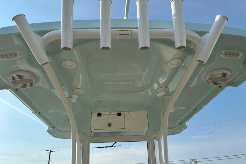 Slide: The Image of 2026 Sea Pro 245FLX Sandbar boat roof with rod holders and speakers. - 14