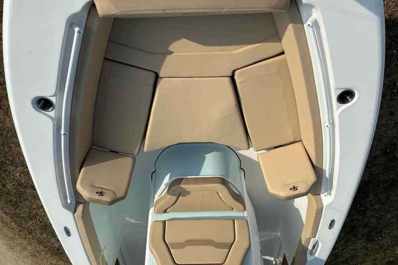 Slide: The Image of 2026 Sea Pro 245FLX Sandbar boat interior with tan cushioned seating. - 22