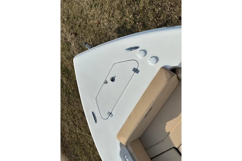 Slide: The Image of 2026 Sea Pro 245FLX Sandbar boat deck with beige seating and storage hatch. - 28