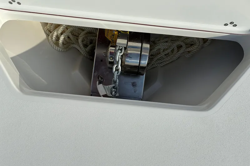 Slide: The Image of Anchor compartment of 2026 Sea Pro 245FLX Sandbar with rope and chain. - 29