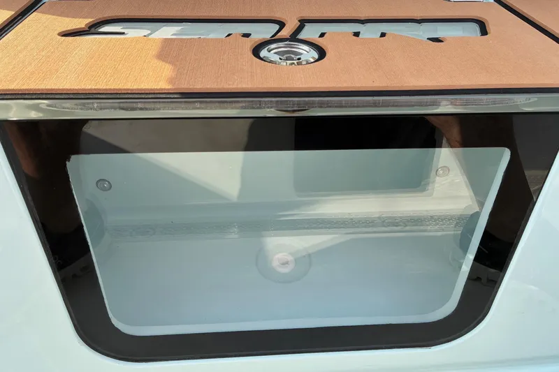 Slide: The Image of 2026 Sea Pro 245FLX Sandbar boat with transparent compartment and wooden finish. - 38