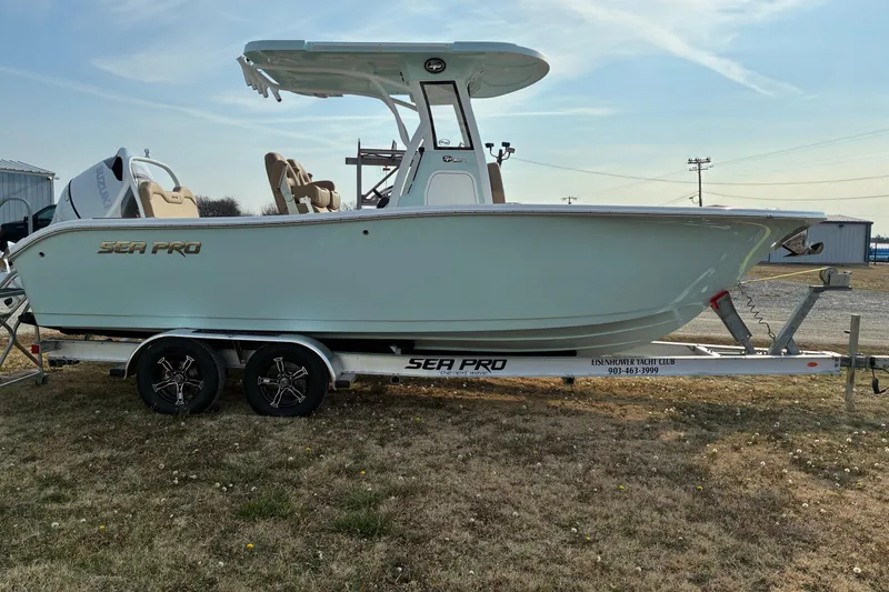 Slide: The Image of 2026 Sea Pro 245FLX Sandbar boat on trailer, side view, outdoors. - 4
