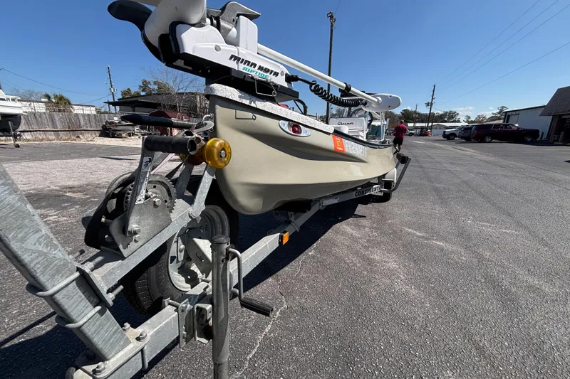 Slide: The Image of 2017 GHEENUE Super 16 boat on trailer with Minn Kota motor, parked outdoors. - 12