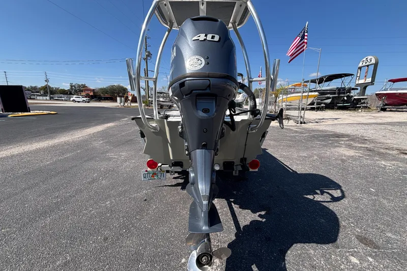 Slide: The Image of 2017 GHEENUE Super 16 boat with 40 HP outboard motor, parked outdoors. - 15