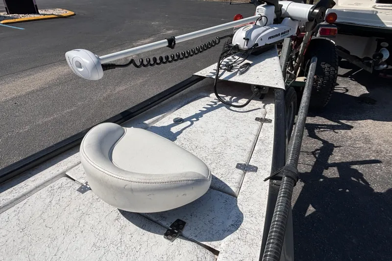 Slide: The Image of 2017 GHEENUE Super 16 boat with Minn Kota trolling motor and white seat on trailer. - 4