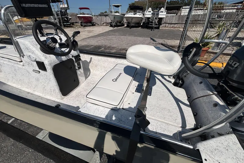 Slide: The Image of 2017 GHEENUE Super 16 boat interior with steering wheel and seating. - 9