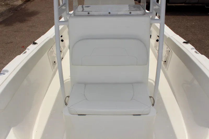 Slide: The Image of 2024 Clear Water 2200 CC boat interior with white seating and console. - 14