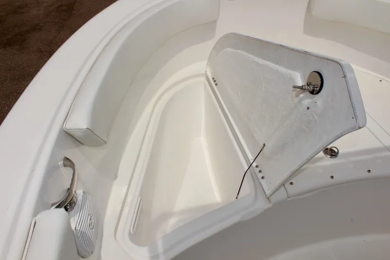 Slide: The Image of 2024 Clear Water 2200 CC boat interior with open storage compartment. - 18