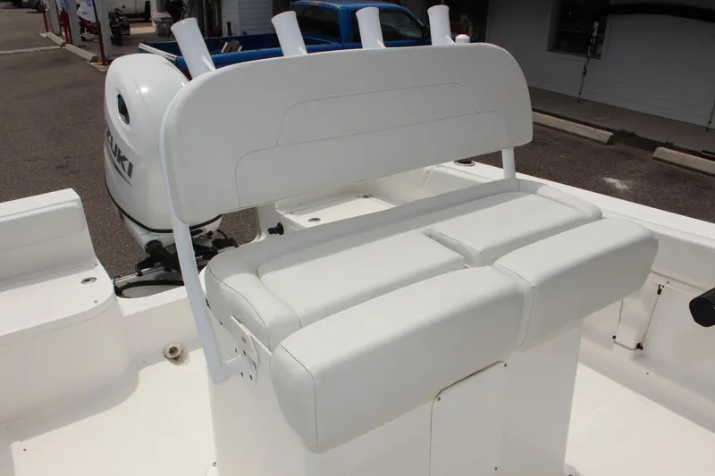 Slide: The Image of 2024 Clear Water 2200 CC boat with white seating and Suzuki outboard motor. - 12