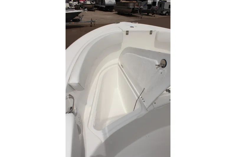 Slide: The Image of 2024 Clear Water 2200 CC boat interior with open storage compartment. - 19