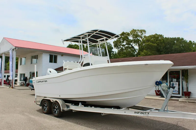 Slide: The Image of 2024 Clear Water 2200 CC boat on trailer outside dealership. - 5