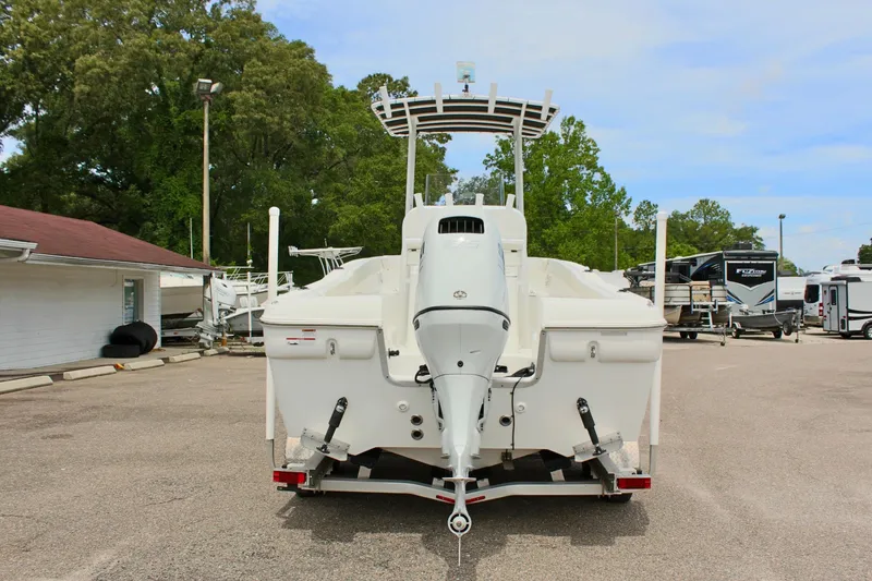 Slide: The Image of 2024 Clear Water 2200 CC boat on trailer, rear view, in outdoor setting. - 7