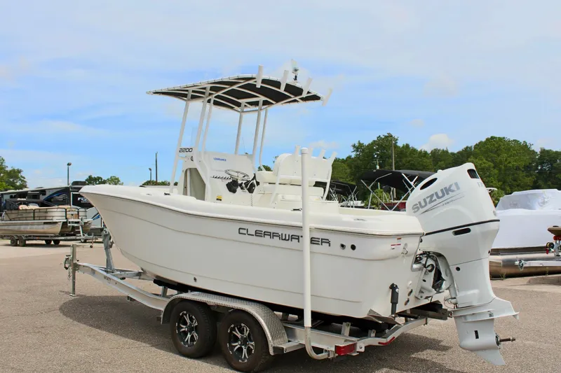 Slide: The Image of 2024 Clear Water 2200 CC boat with Suzuki engine on a trailer. - 8