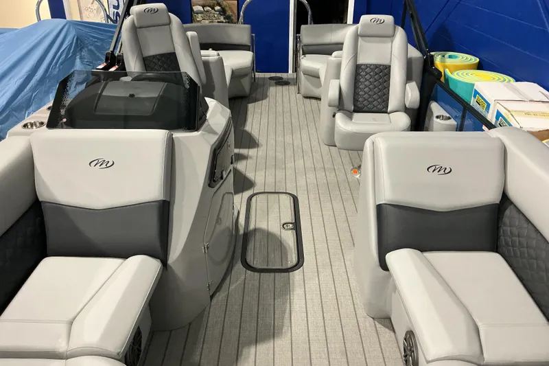 Slide: The Image of Luxurious interior of 2026 Manitou Encore RF SHP575 230 pontoon boat with plush seating. - 11