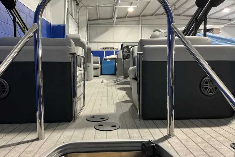 Slide: The Image of 2026 Manitou Encore RF SHP575 230 pontoon boat interior with sleek seating and modern design. - 5