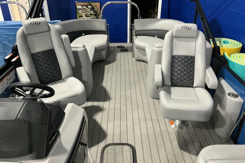 Slide: The Image of 2026 Manitou Encore RF SHP575 230 boat interior with luxurious seating and modern design. - 7