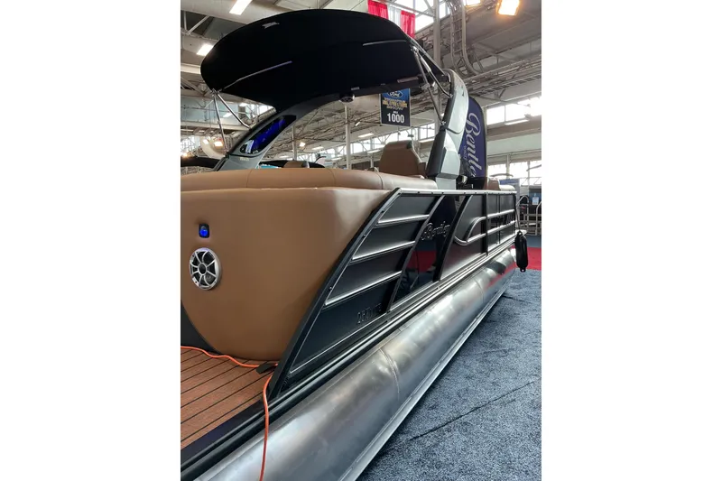 Slide: The Image of 2026 Bentley Pontoons Elite 253 Admiral with extended deck, showcased indoors. - 2