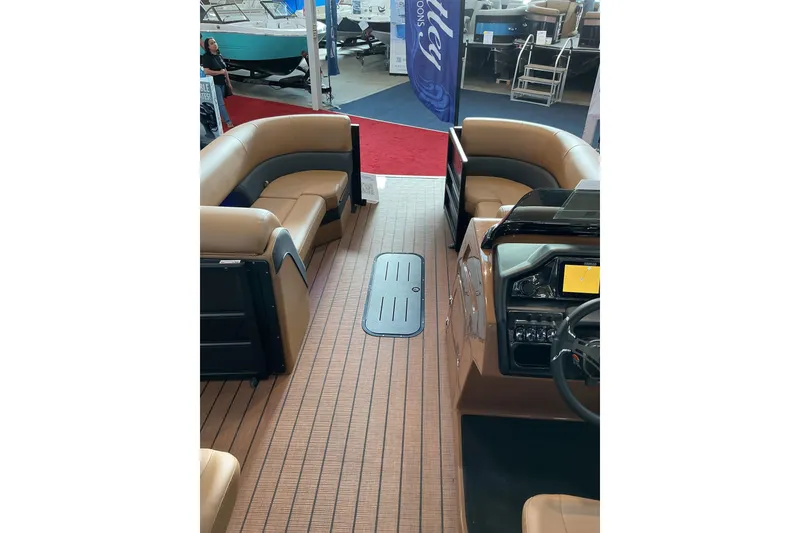 Slide: The Image of 2026 Bentley Pontoons Elite 253 Admiral interior with dual captain seats and extended deck. - 5