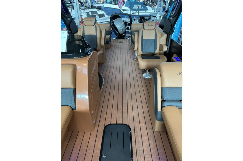 Slide: The Image of 2026 Bentley Pontoons Elite 253 Admiral interior with dual captain seats and extended deck. - 6