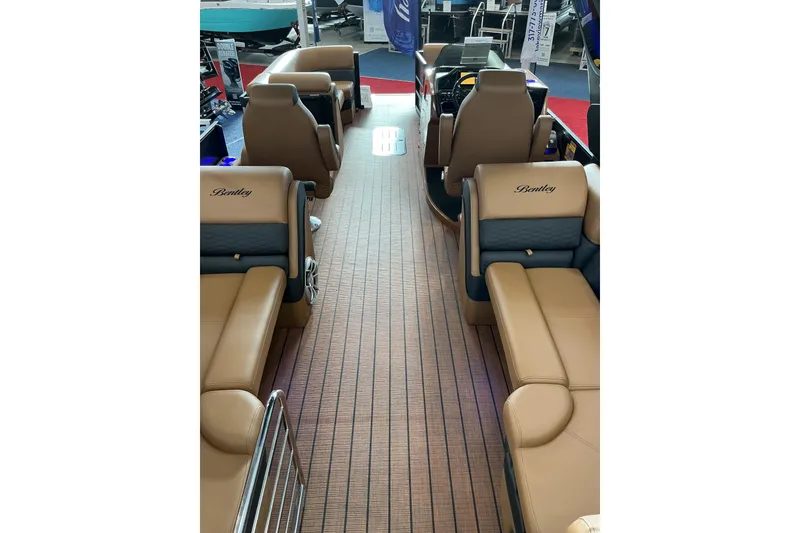 Slide: The Image of 2026 Bentley Pontoons Elite 253 Admiral interior with luxurious seating and extended deck. - 8
