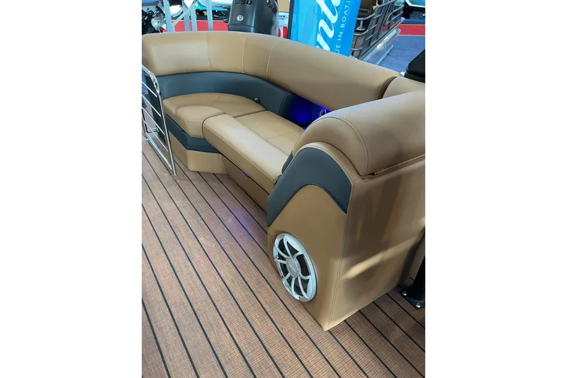 Slide: The Image of Luxurious seating on 2026 Bentley Pontoons Elite 253 Admiral, featuring tan upholstery and speaker system. - 9