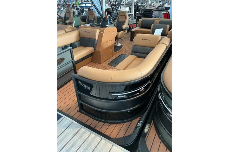 The Image of 2026 Bentley Pontoons Elite 223 Swingback Bench, luxurious interior with tan and gray seating. - 0