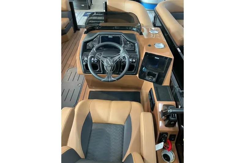 Slide: The Image of 2026 Bentley Pontoons Elite 223 Swingback Bench interior with steering wheel and control panel. - 4