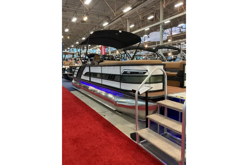 The Image of 2026 Bentley Pontoons Elite 253 Swingback Bench Full Tube displayed at a boat show. - 0