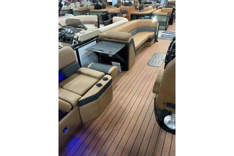 Slide: The Image of 2026 Bentley Pontoons Elite 253 Swingback Bench Full Tube interior with luxurious seating and wood flooring. - 6