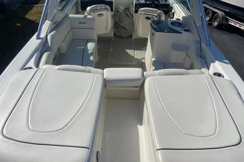 Slide: The Image of 2006 Sea Ray 270 SLX boat interior with white seating and sleek design. - 5