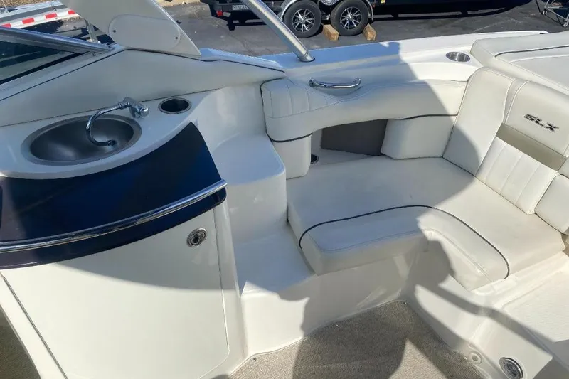 Slide: The Image of 2006 Sea Ray 270 SLX boat interior with seating and sink area. - 6